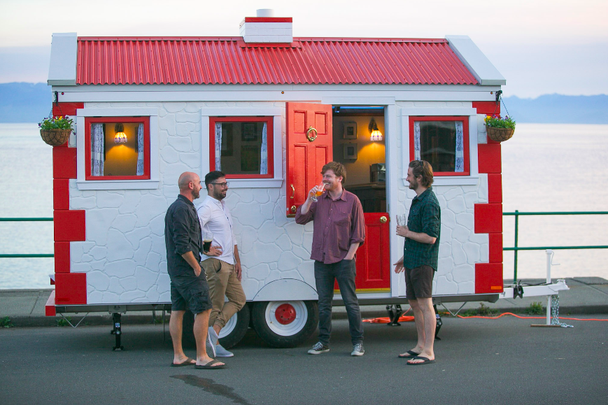 Friends having a drink outside the mobile pub.