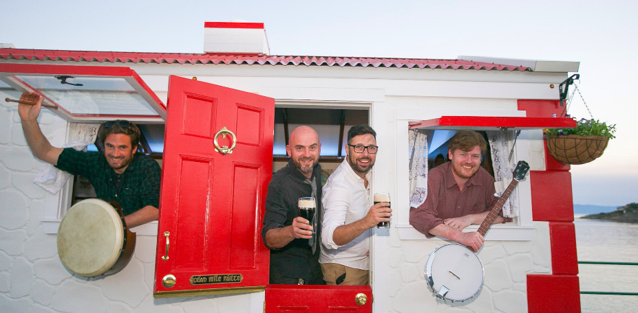 Bartenders and musicians at the cottage windows.